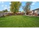 Large backyard with patio, shed, and grassy area at 1586 S Field Ct, Lakewood, CO 80232