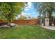 Spacious backyard with wooden fence and shed at 1586 S Field Ct, Lakewood, CO 80232