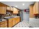 Basement kitchen with wood cabinets and granite countertops at 1586 S Field Ct, Lakewood, CO 80232