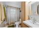 Clean bathroom with shower/tub combo and updated vanity at 1586 S Field Ct, Lakewood, CO 80232