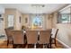 Dining room with a large table, six chairs, and modern light fixture at 1586 S Field Ct, Lakewood, CO 80232