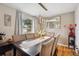 Bright dining room featuring a spacious table and six chairs at 1586 S Field Ct, Lakewood, CO 80232