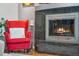 Inviting living room fireplace with a modern design and wood-burning at 1586 S Field Ct, Lakewood, CO 80232