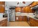 Bright kitchen with stainless steel appliances and ceiling fan at 1586 S Field Ct, Lakewood, CO 80232