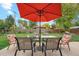 Relaxing patio area with table and chairs, perfect for outdoor dining at 1586 S Field Ct, Lakewood, CO 80232