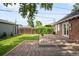 Charming backyard with brick patio and lush green lawn at 2635 Kearney St, Denver, CO 80207