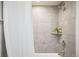 Modern bathroom featuring a tiled shower with a niche and a white shower curtain at 2635 Kearney St, Denver, CO 80207
