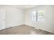 Bright bedroom with hardwood floors, a window, and a ceiling fan at 2635 Kearney St, Denver, CO 80207