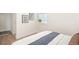 Cozy bedroom with ample natural light, wood floors, and modern decor at 2635 Kearney St, Denver, CO 80207