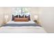 Bright bedroom with large window, plush bedding, and decorative pillows at 2635 Kearney St, Denver, CO 80207