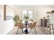Cozy dining area featuring a modern table and chairs, complemented by a bright and airy atmosphere at 2635 Kearney St, Denver, CO 80207