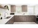 Modern kitchen featuring sleek countertops, ample cabinet space, and contemporary appliances for culinary enthusiasts at 2635 Kearney St, Denver, CO 80207