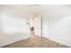 Bright room with wood floors, white trim, and open doorway at 2635 Kearney St, Denver, CO 80207