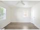 Spacious room with natural light, ceiling fan, and wood floors at 2635 Kearney St, Denver, CO 80207