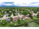 Aerial view showcasing the home and surrounding area, featuring lush landscape and distant mountains at 6666 S Pennsylvania St, Centennial, CO 80121