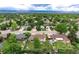 An aerial image illustrating the home's location and neighborhood greenery against a mountain backdrop at 6666 S Pennsylvania St, Centennial, CO 80121