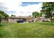 Spacious backyard with well-kept lawn, patio, and beautiful landscaping at 6666 S Pennsylvania St, Centennial, CO 80121