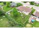 Aerial view of the home's backyard with a patio, greenhouse, garden, and spacious lawn at 6666 S Pennsylvania St, Centennial, CO 80121