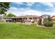 Well-maintained backyard featuring a patio, flower garden, and ample green space at 6666 S Pennsylvania St, Centennial, CO 80121