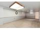 Spacious basement has neutral carpet and paint with natural light from multiple windows at 6666 S Pennsylvania St, Centennial, CO 80121