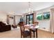 Inviting dining area with chandelier, table set for two, and adjacent seating area with comfortable recliner at 6666 S Pennsylvania St, Centennial, CO 80121