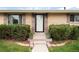 Charming front entry with manicured bushes and updated door at 6666 S Pennsylvania St, Centennial, CO 80121