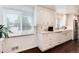 Updated kitchen with white cabinets, granite countertops, stainless appliances, and sunlit window at 6666 S Pennsylvania St, Centennial, CO 80121