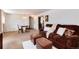 Cozy living room with plush furniture and a dining area in the background at 6666 S Pennsylvania St, Centennial, CO 80121