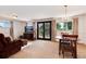Gathering room with furniture, TV, and glass doors to the backyard at 6666 S Pennsylvania St, Centennial, CO 80121