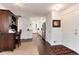 Open-concept layout with office space, flows to the kitchen and entryway at 6666 S Pennsylvania St, Centennial, CO 80121