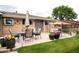 Outdoor patio with patio furniture, an umbrella and a swing for relaxation and entertainment at 6666 S Pennsylvania St, Centennial, CO 80121