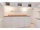 Well lit storage room with shelving and a countertop for organizing belongings at 6666 S Pennsylvania St, Centennial, CO 80121