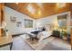 This bedroom features a large bed with bench and carpeted floors, as well as multiple windows at 77 Krestview Ln, Golden, CO 80401