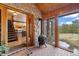 Inviting entryway featuring stone walls, brick floors, and a wood-burning stove at 77 Krestview Ln, Golden, CO 80401