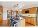 Spacious kitchen with wood cabinets, granite countertops, and a large island at 77 Krestview Ln, Golden, CO 80401