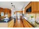 Modern kitchen with wood cabinets, granite countertops, and stainless steel appliances at 77 Krestview Ln, Golden, CO 80401