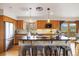 Bright kitchen featuring wood cabinets, granite countertops, stainless steel appliances at 77 Krestview Ln, Golden, CO 80401