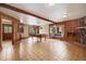 Spacious living room with tile flooring, wooden accents, a pool table, and natural light at 77 Krestview Ln, Golden, CO 80401