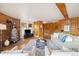 Comfortable living room features hardwood floors, a brick fireplace, and ample seating at 77 Krestview Ln, Golden, CO 80401
