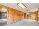 Wood-paneled living room featuring neutral carpet and natural light at 77 Krestview Ln, Golden, CO 80401