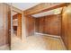 An additional room features wood paneling, tile floor and a closet at 77 Krestview Ln, Golden, CO 80401