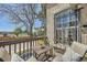 Balcony featuring an outdoor seating area with a view of the neighborhood and trees at 2695 S Ames Way # 1, Lakewood, CO 80227