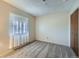 Cozy bedroom boasts natural light and neutral carpeting with a closet for storage at 2695 S Ames Way # 1, Lakewood, CO 80227