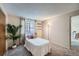 Bedroom with a neutral color palette with carpeted floors and bright natural lighting at 2695 S Ames Way # 1, Lakewood, CO 80227