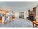 Open concept living room featuring a fireplace, hardwood floors, and updated appliances at 2695 S Ames Way # 1, Lakewood, CO 80227