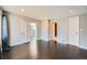 Bedroom featuring neutral tones, hardwood floors, and plenty of closet space at 3348 S Corona St, Englewood, CO 80113