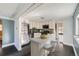 Modern kitchen with stainless steel appliances and breakfast bar at 3348 S Corona St, Englewood, CO 80113