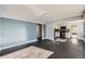 Bright living room with dark hardwood floors and view into kitchen at 3348 S Corona St, Englewood, CO 80113