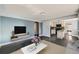 Bright living room open to kitchen, showcasing modern finishes and natural light at 3348 S Corona St, Englewood, CO 80113