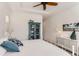 Main bedroom with white metal bed frame and blue accents at 12432 Meadowlark Ln, Broomfield, CO 80021